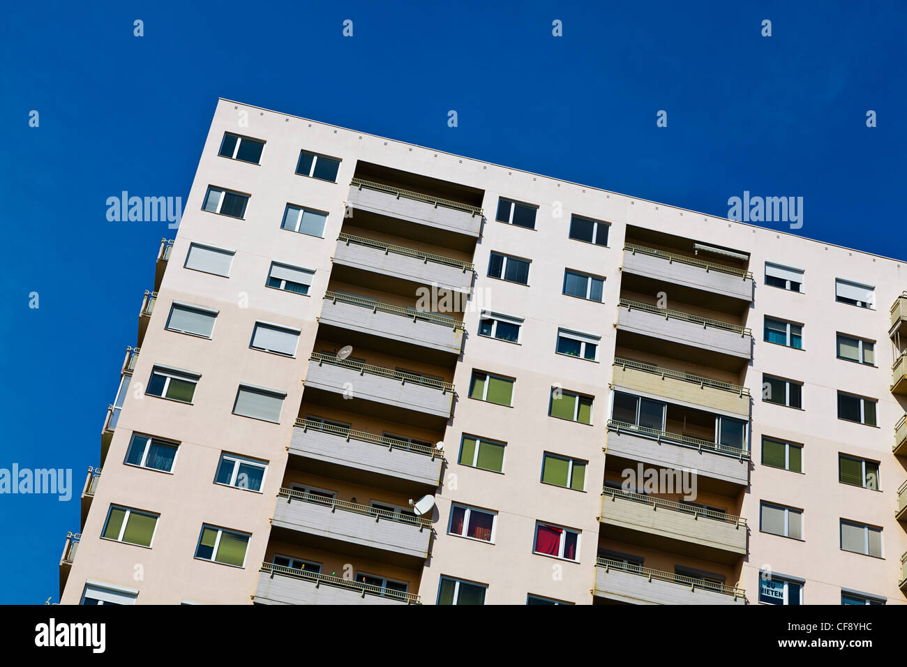 a high-rise apartment building with balconies than in a city Stock Photo
