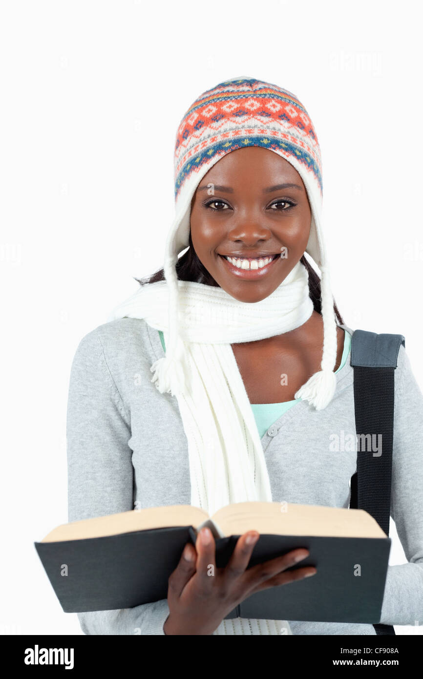 Close up of smiling student holding her book Stock Photo - Alamy