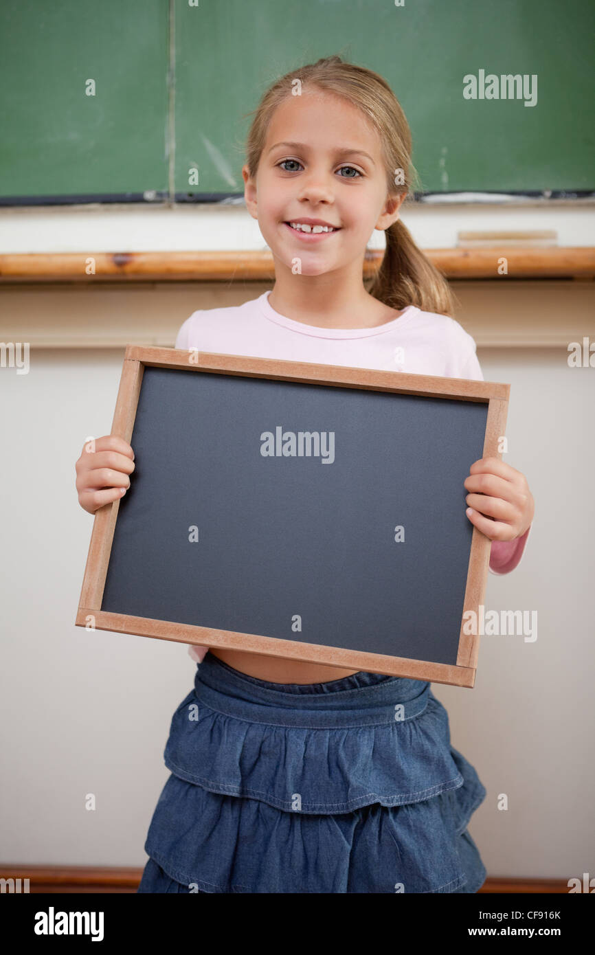 School girl holding slate hi-res stock photography and images - Alamy