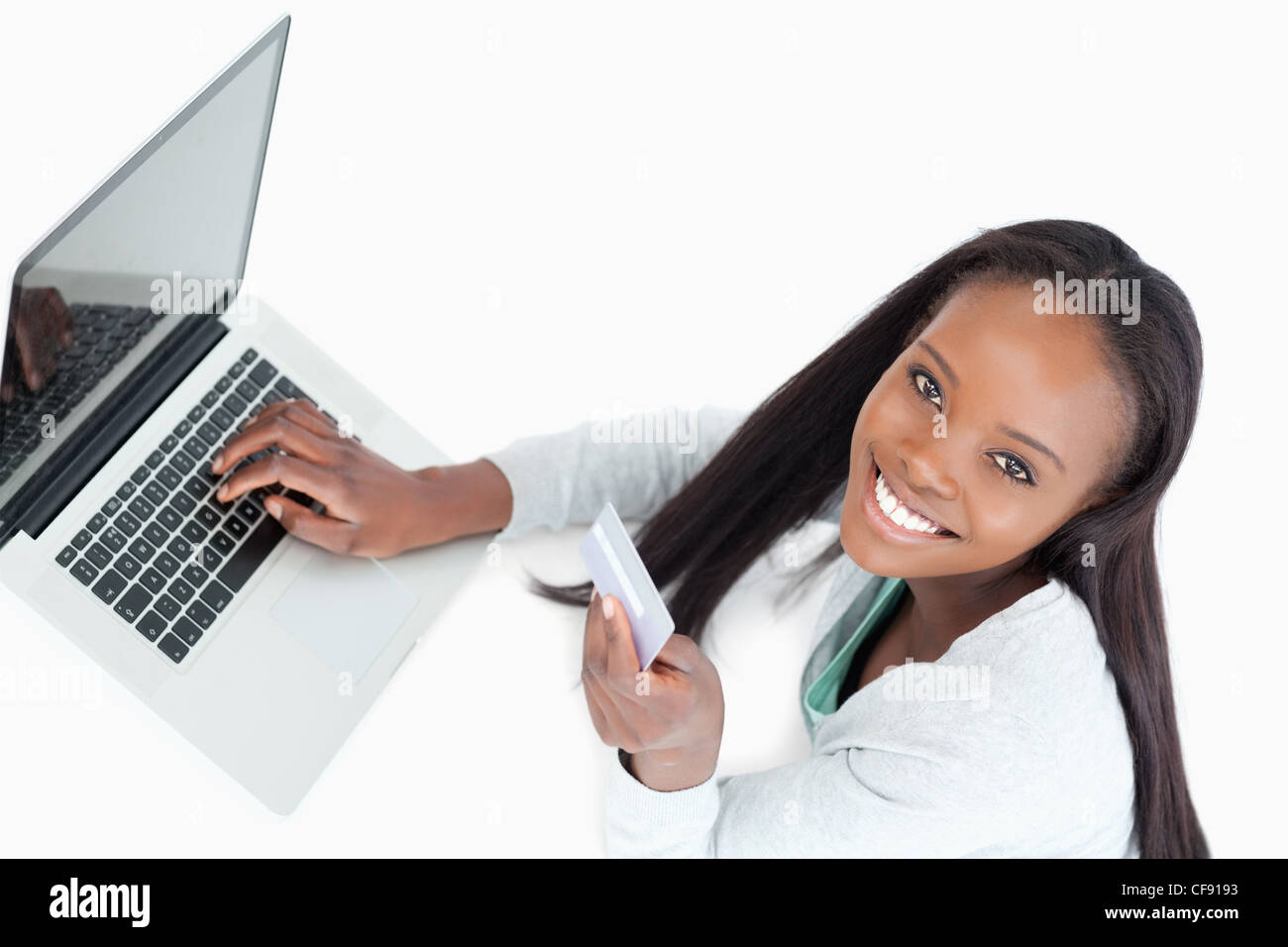 Smiling woman booking flight online Stock Photo