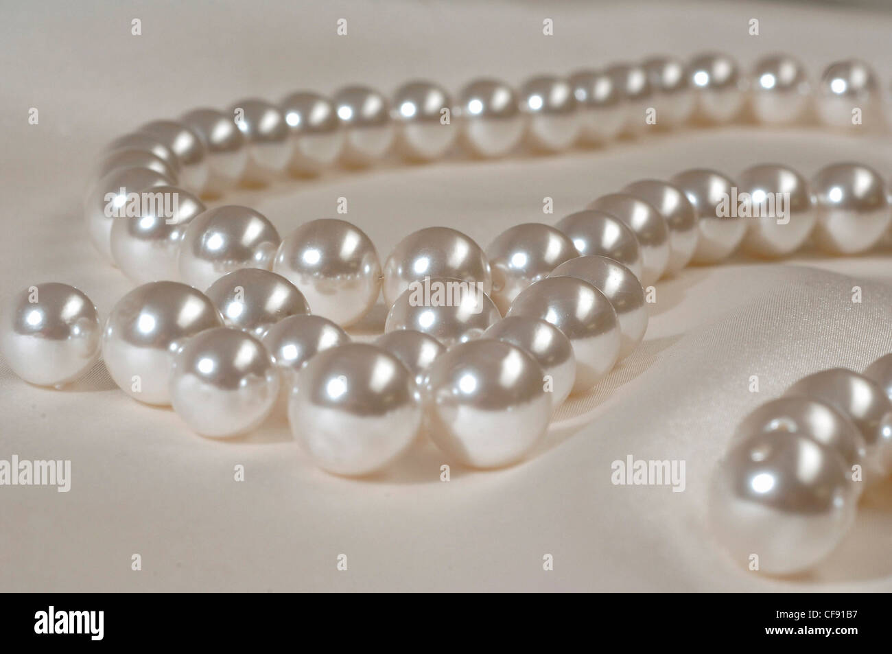 a string of fake pearls Stock Photo - Alamy