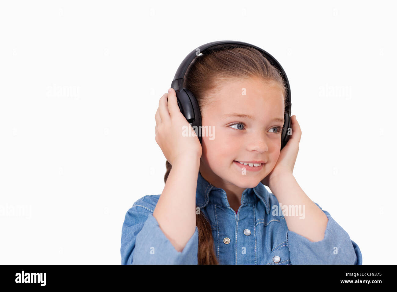 Smiling girl listening to music Stock Photo - Alamy