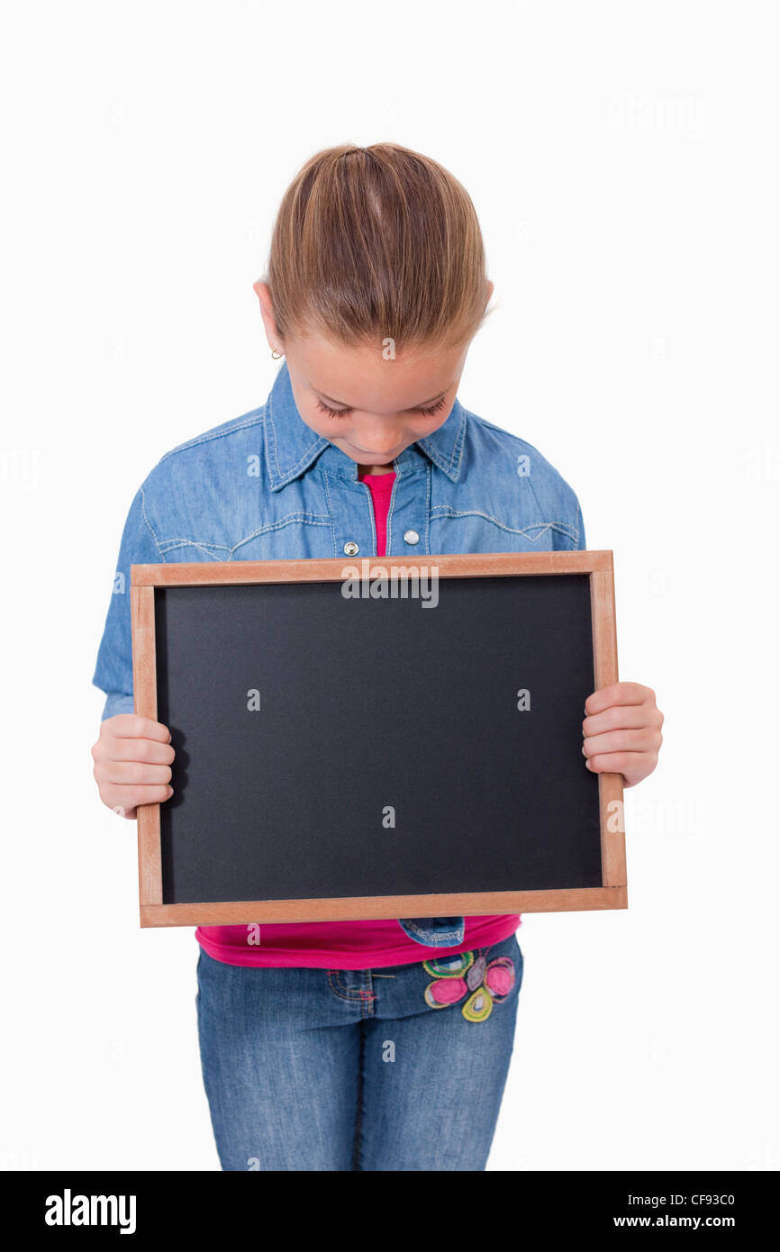 Portrait of a young girl looking at a school slate Stock Photo - Alamy