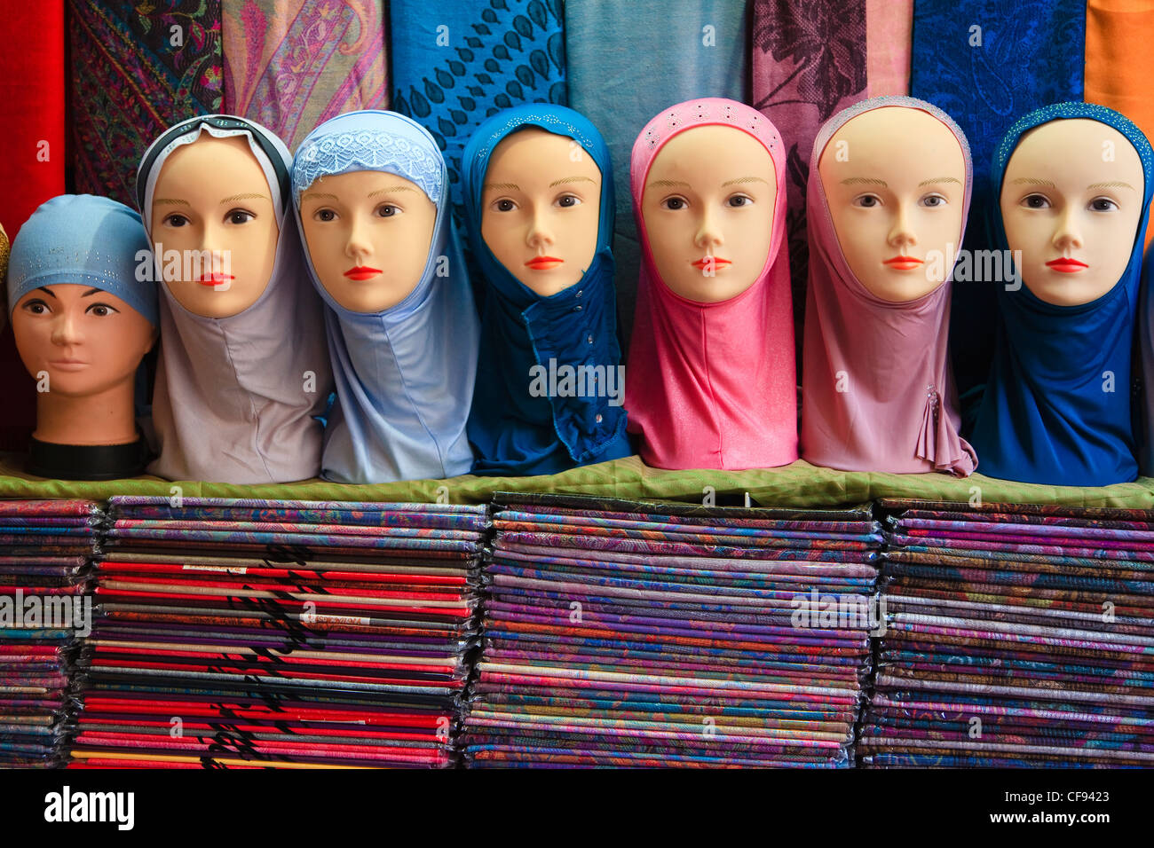 Manikin heads displaying a selection of headscarf, in a shop, Old Town