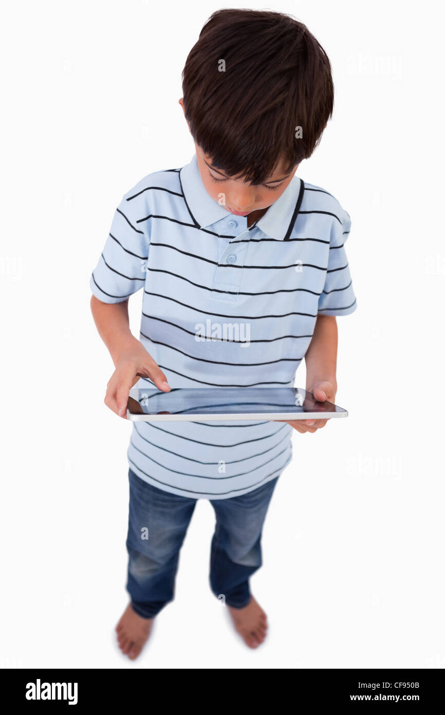 Portrait of a little boy using a tablet computer Stock Photo - Alamy