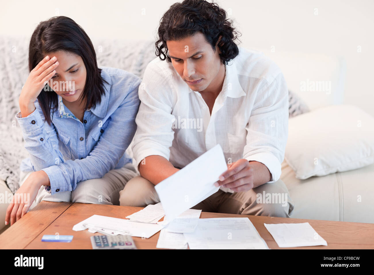 Couple depressed about financial problems Stock Photo