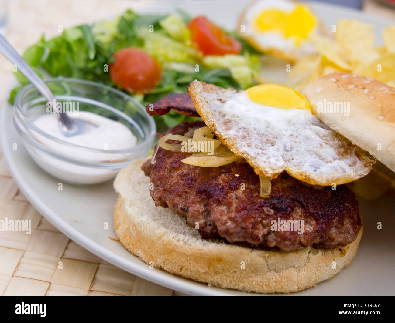 Grilled hamburger with fried egg and salad Stock Photo Alamy