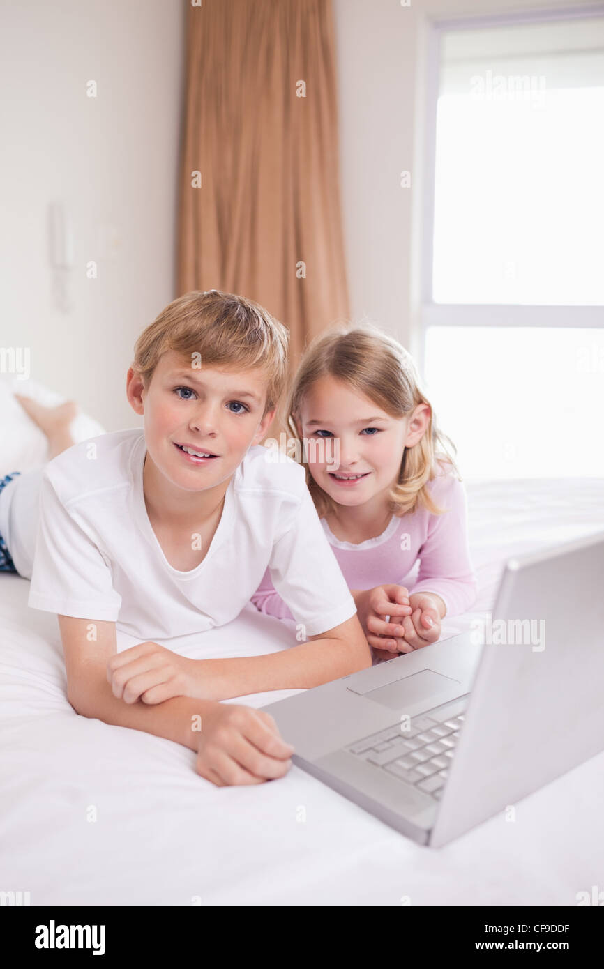Portrait of children using a laptop Stock Photo - Alamy