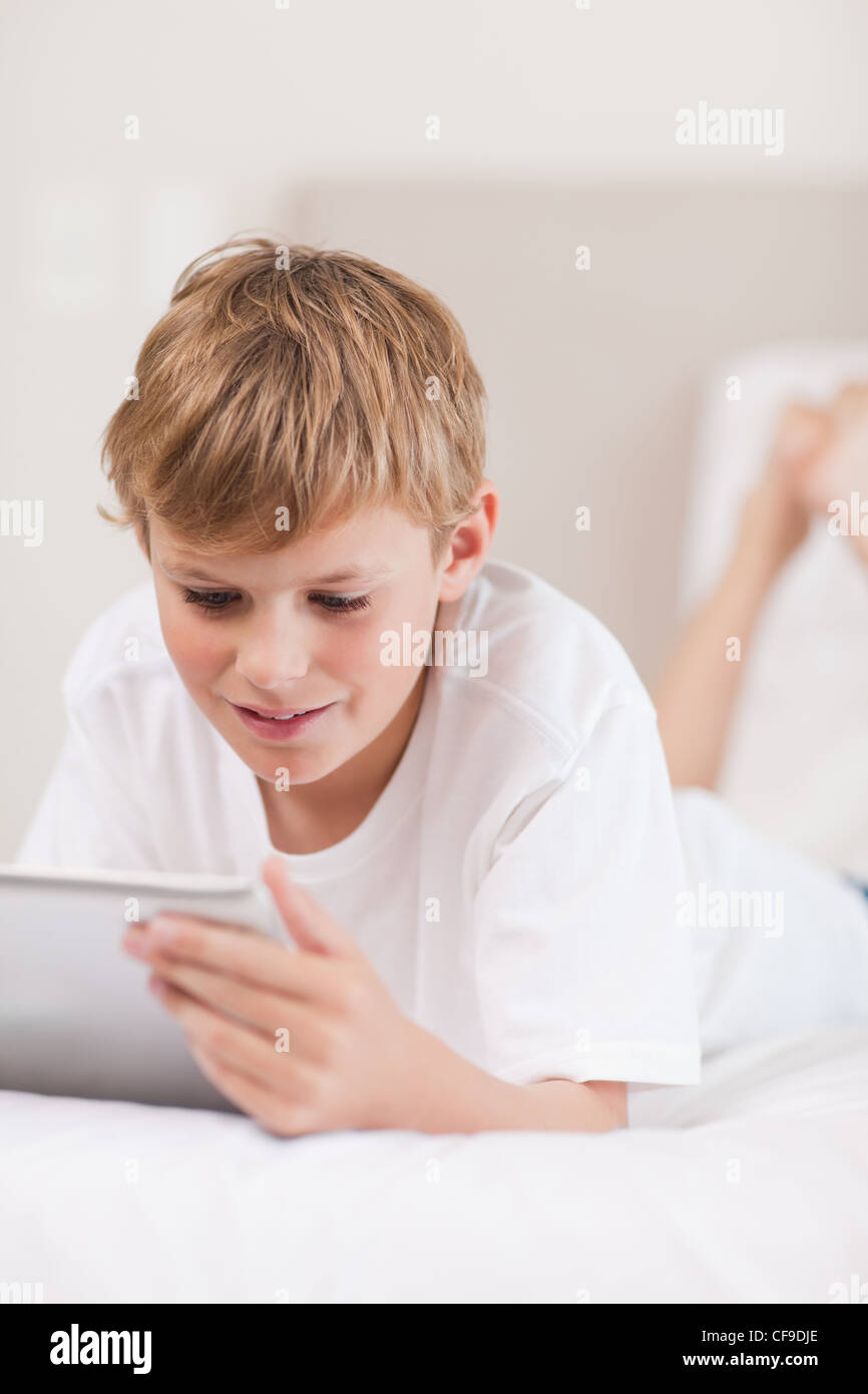 Portrait of a young boy using a tablet computer Stock Photo - Alamy