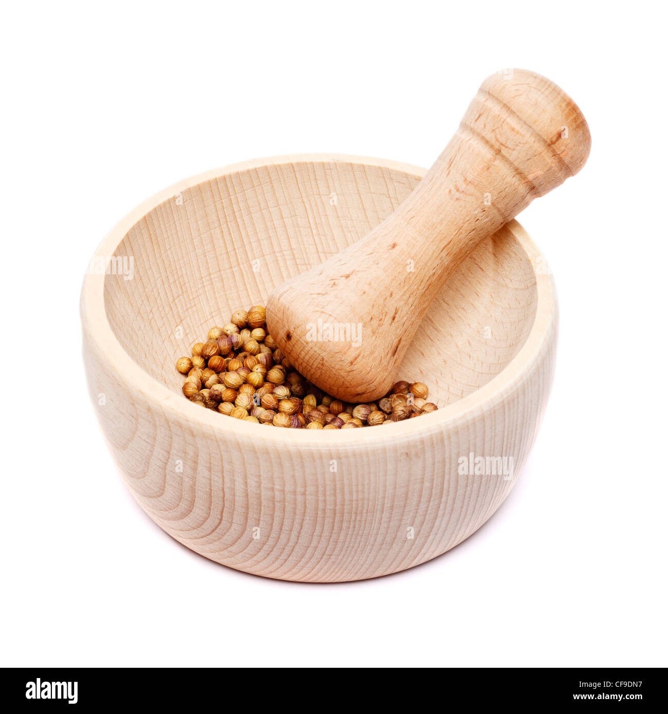 Pestle and mortar with coriander seeds Stock Photo