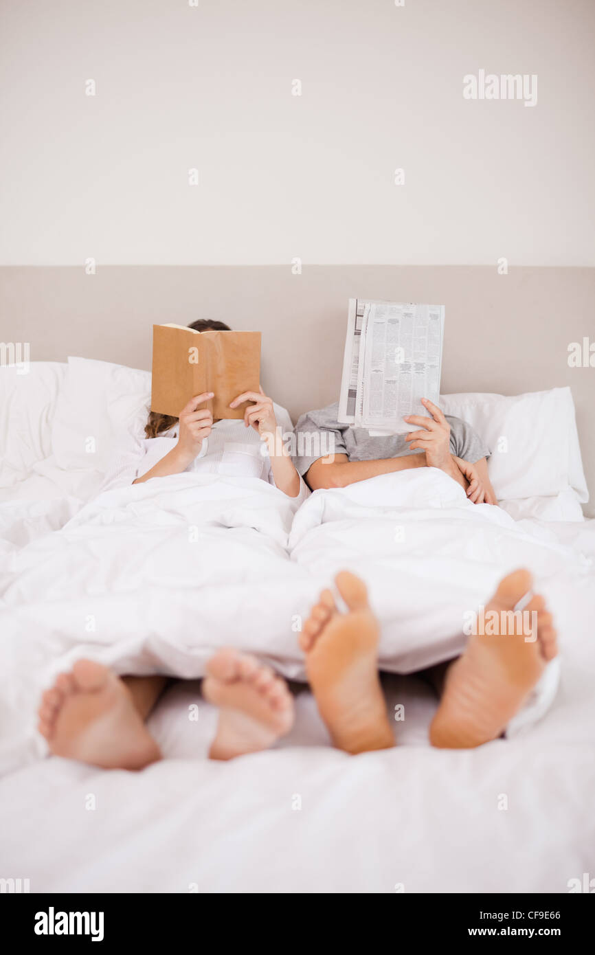 Portrait of playful couple reading Stock Photo