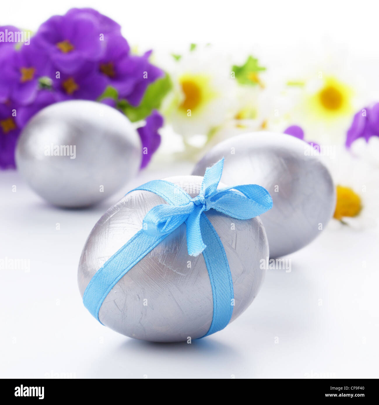 Easter eggs with bows over white background Stock Photo - Alamy