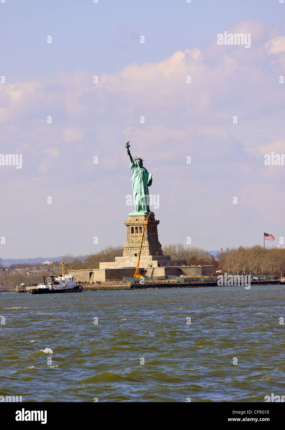 The Statue of Liberty in New York Harbor viewed from Brooklyn NY Stock Photo