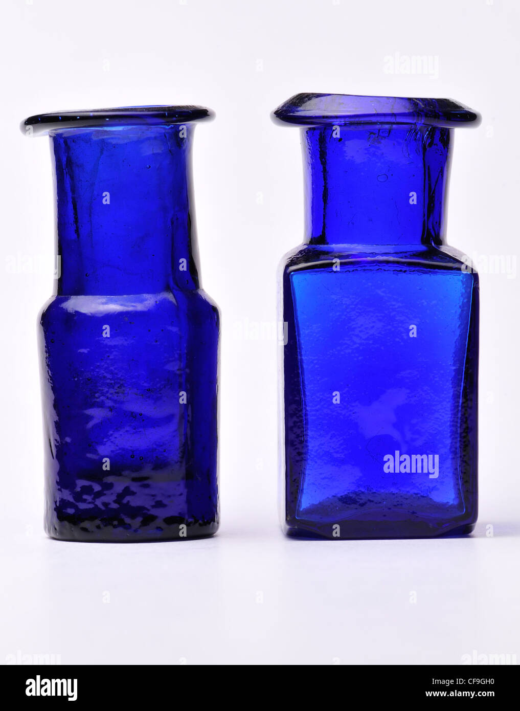 Small cobalt blue antique glass bottles (c2cm high) Stock Photo