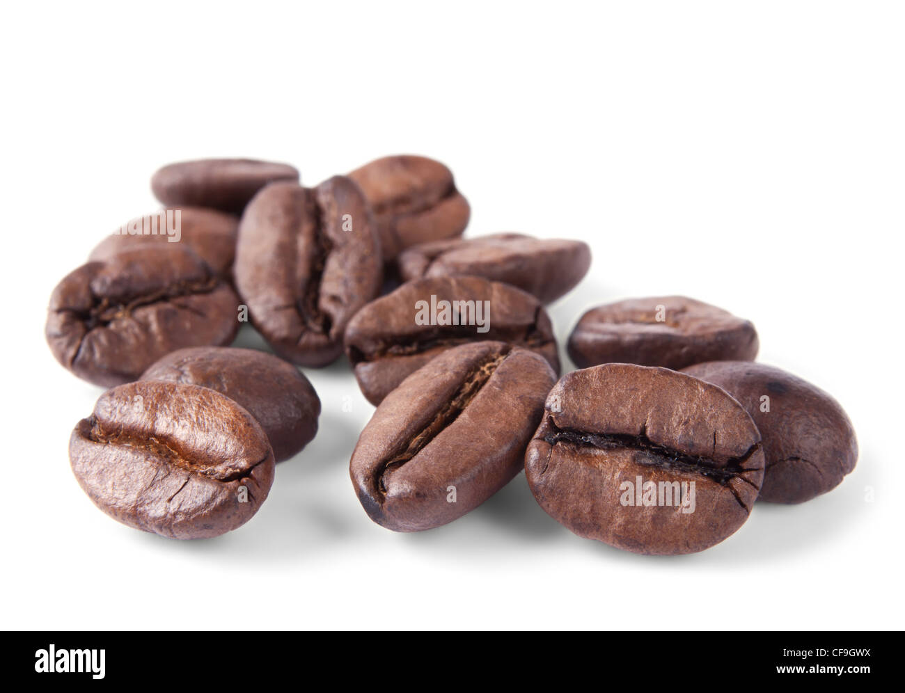 Coffee beans in closeup isolated on white background Stock Photo - Alamy
