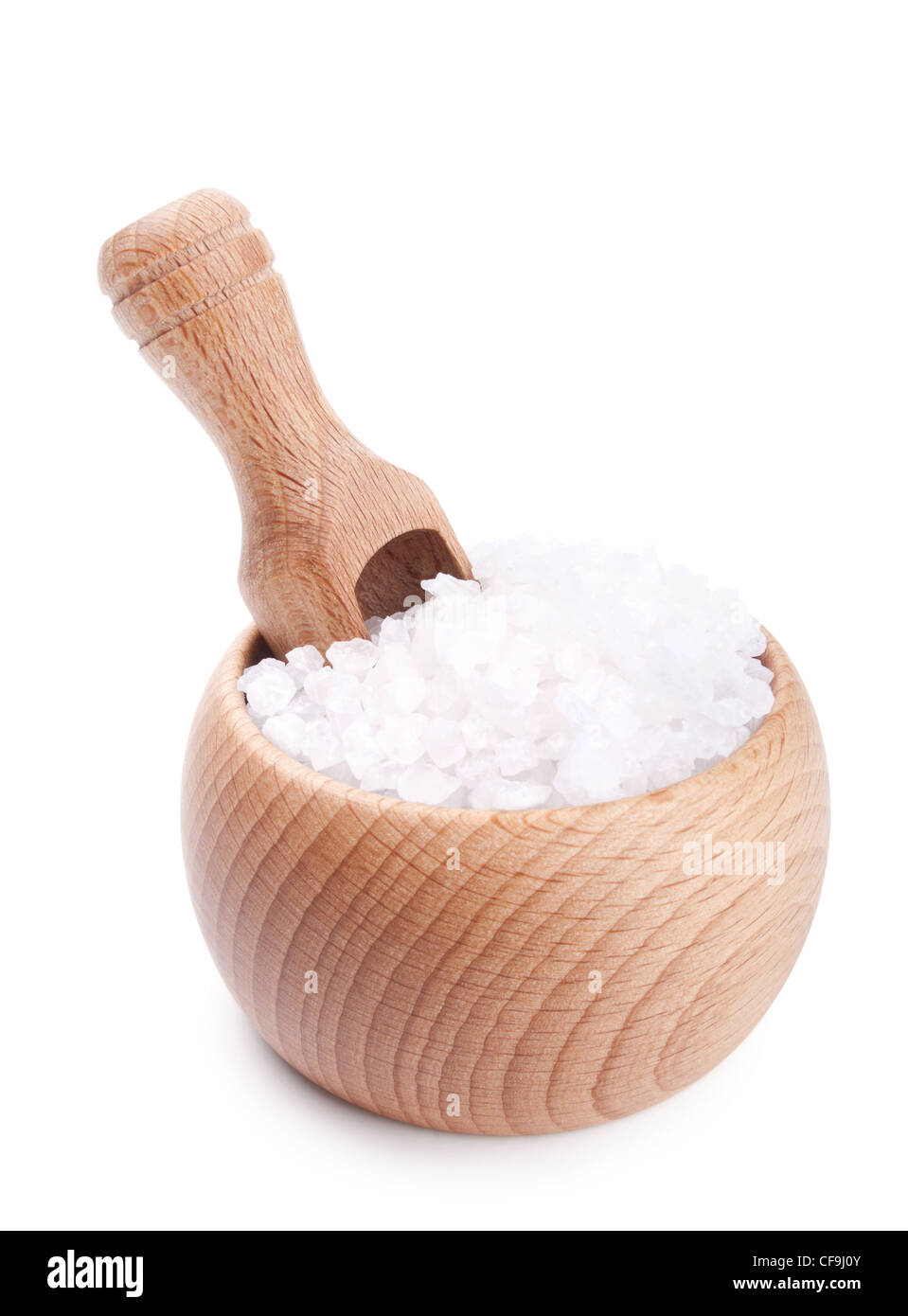Wooden scoop in bowl full of sea salt isolated on white background Stock Photo