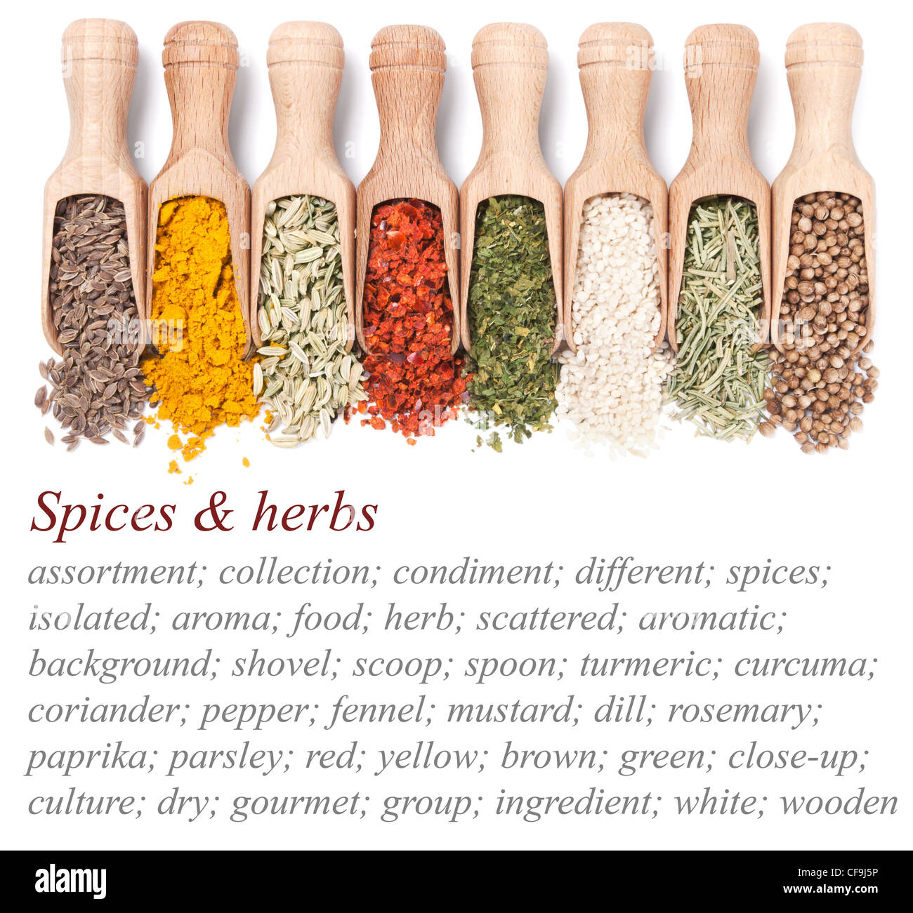 Wooden shovels with different spices scattered from them. Sample text on left side Stock Photo