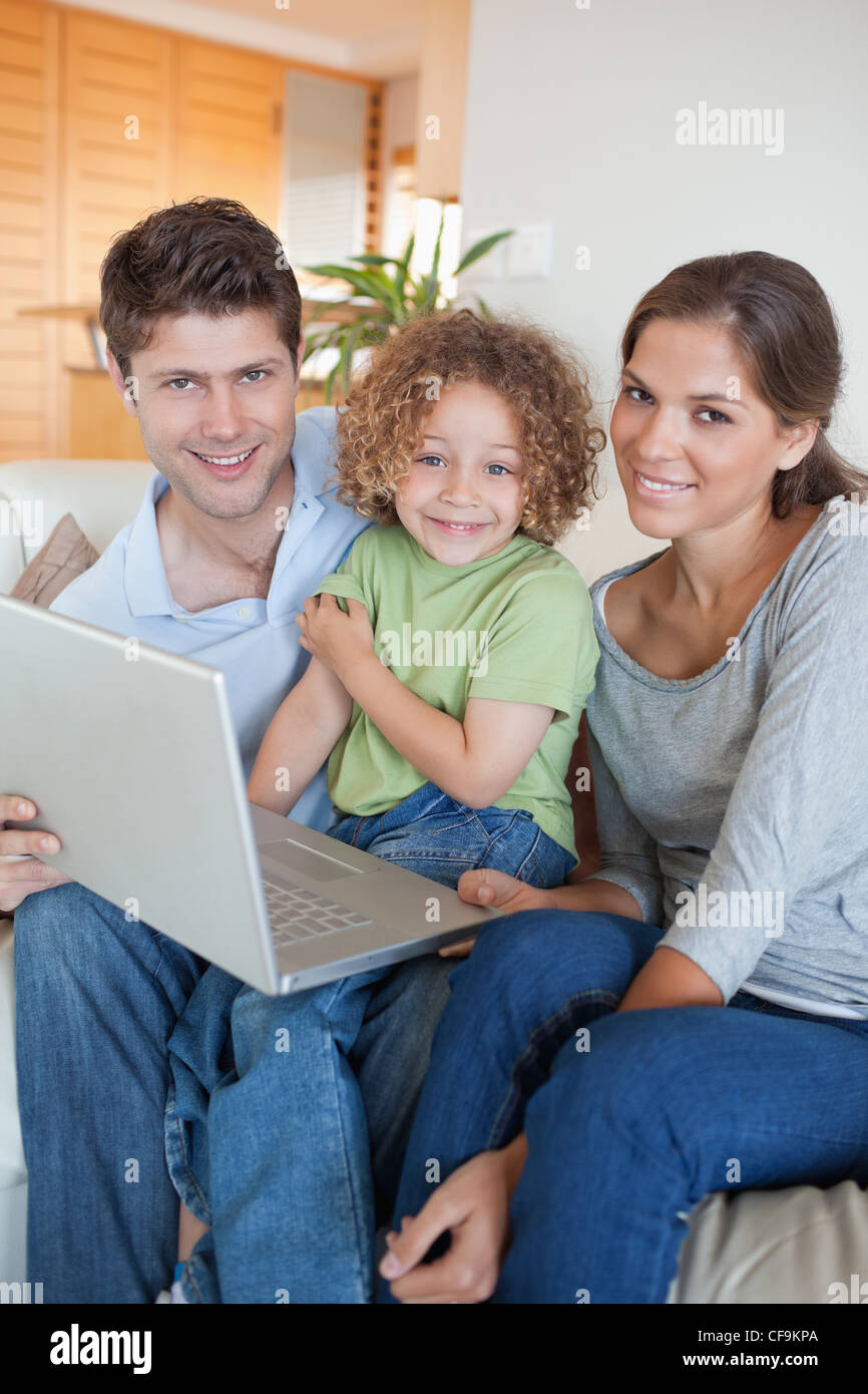 Portrait of a family using a laptop Stock Photo - Alamy