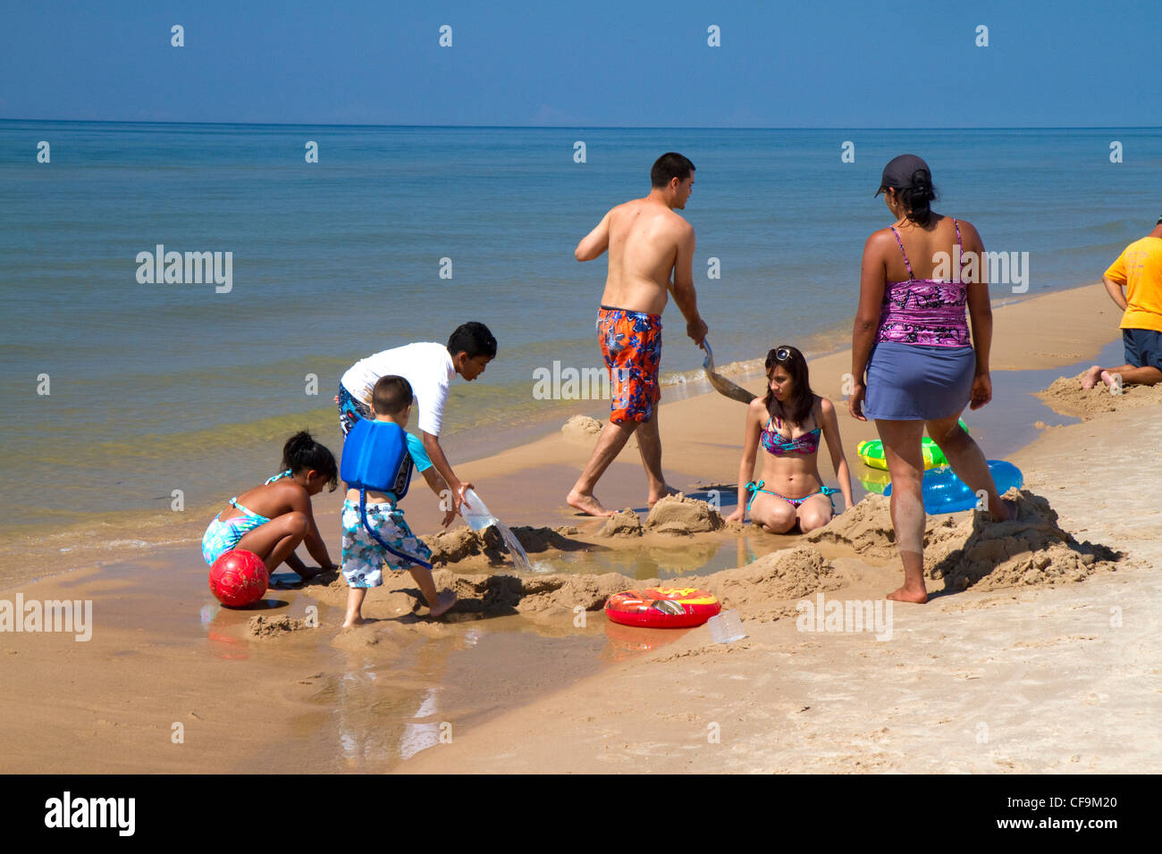 People on the beach at Little Sable Point Light on Lake Michigan in Golden Township, Michigan, USA. Stock Photo