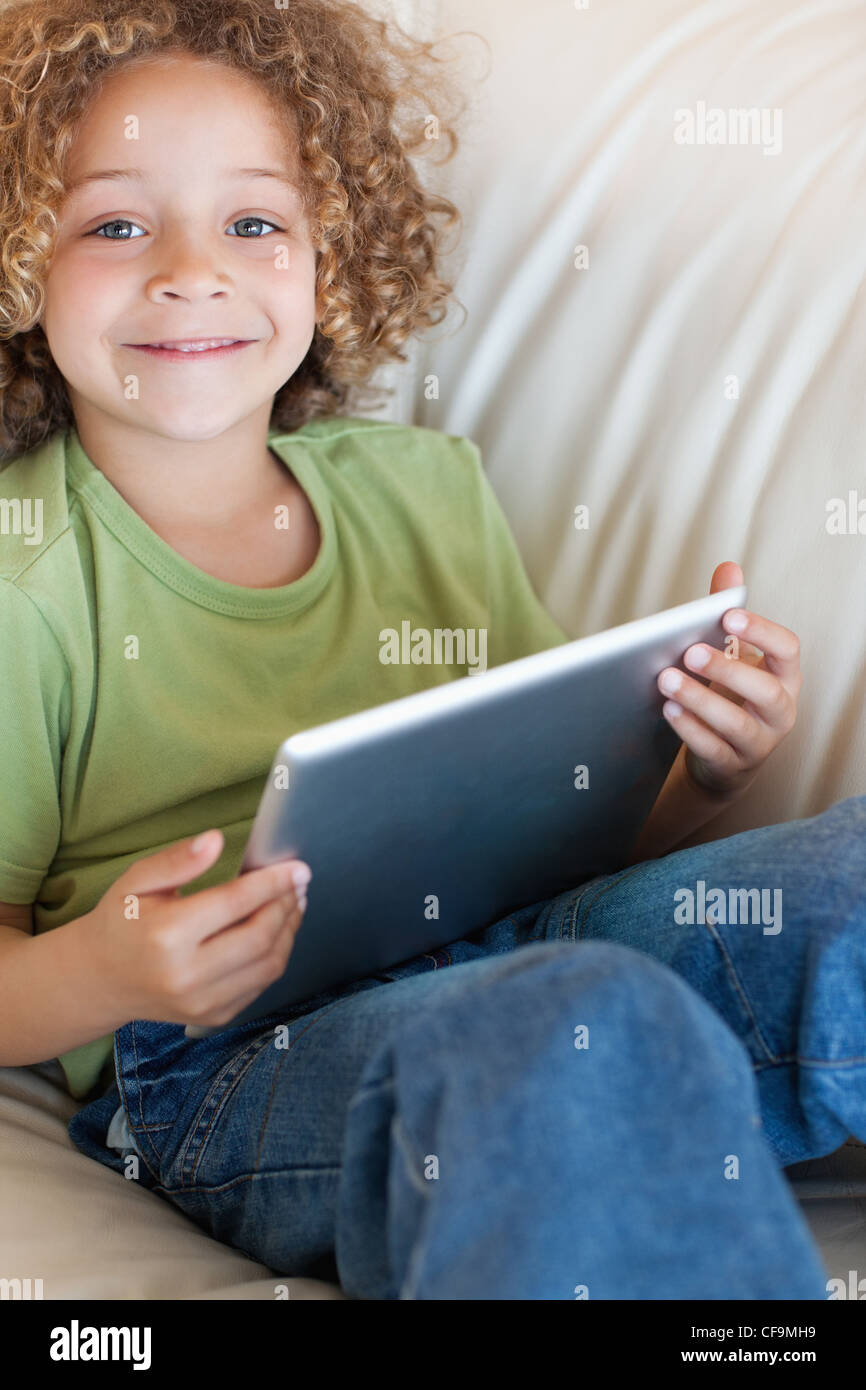 Portrait of a boy using a tablet computer Stock Photo - Alamy