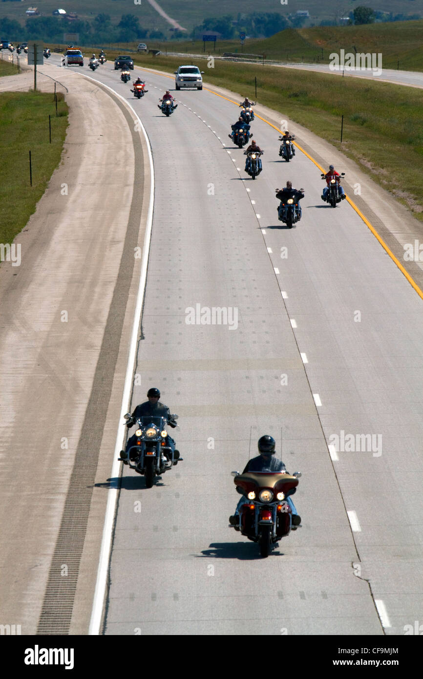 Motorcycles and automobiles travel on I-90 during Sturgis Motorcycle rally week west of Spearfish, South Dakota, USA Stock Photo