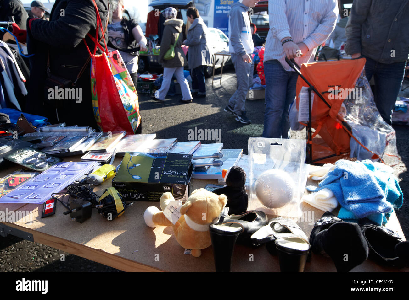 selling items at an early morning car boot sale in Belfast Northern