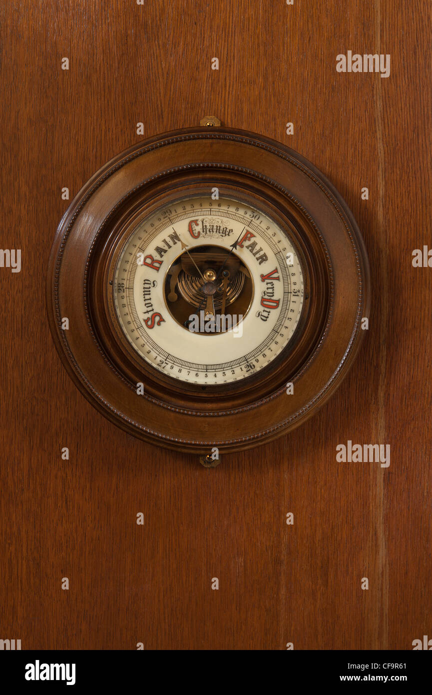 Old classic collectible aneroid barometer used for measuring and forecasting weather condition
