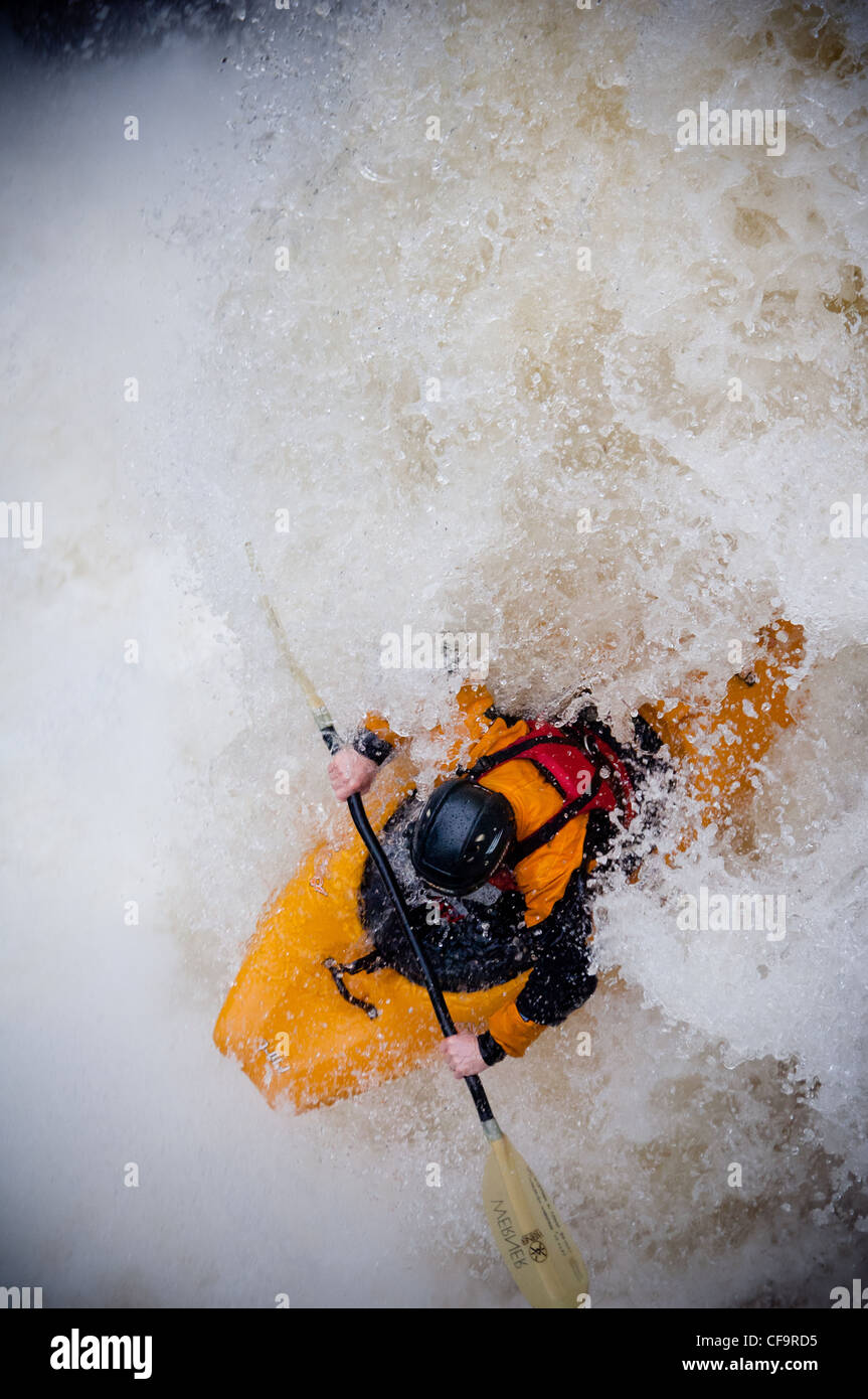 kayak about to drop of whitewater waterfall on the river nevis in