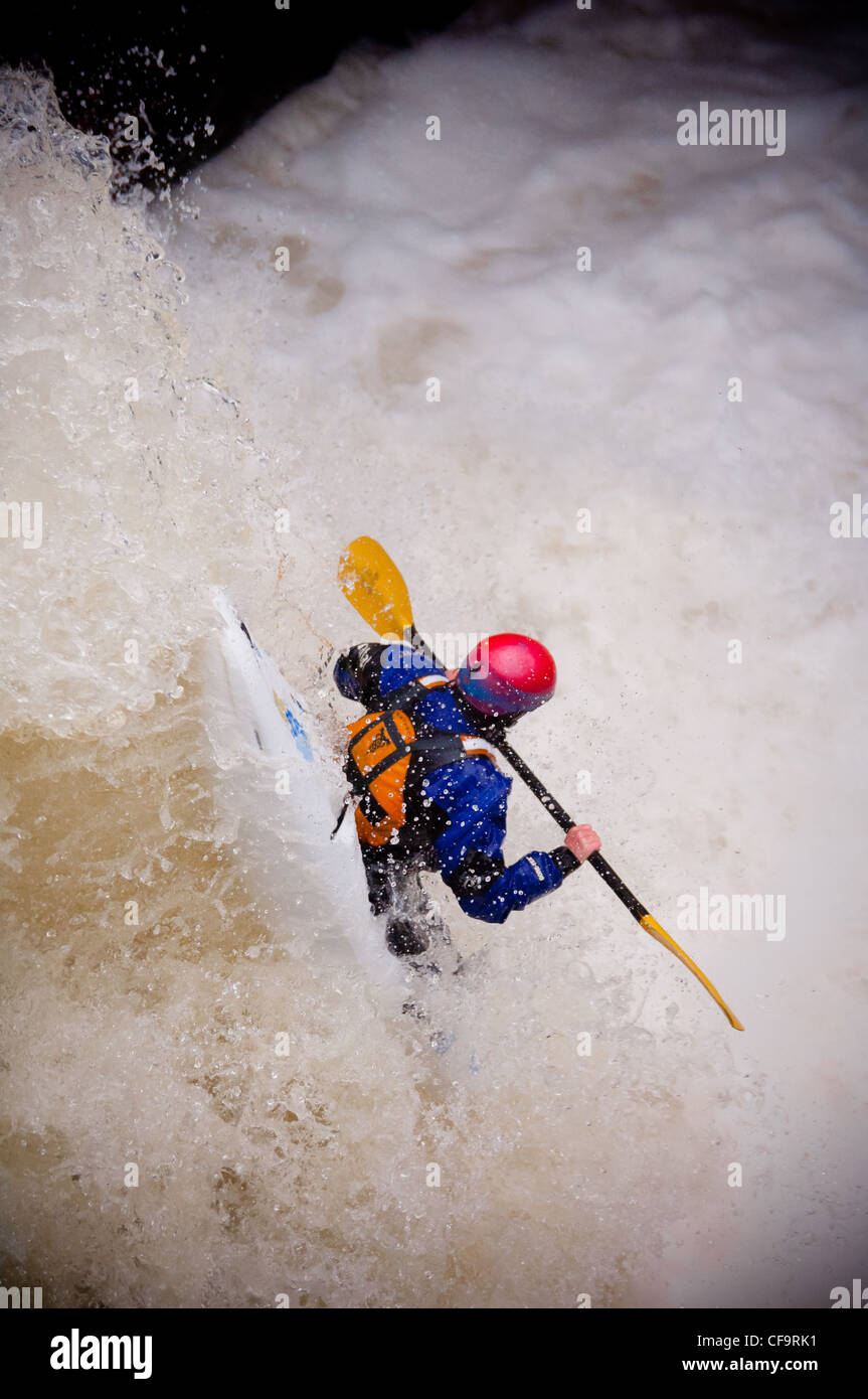 kayak about to drop of whitewater waterfall on the river nevis in