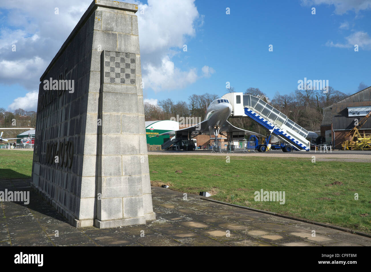 Brooklands Memorial and Concorde G-BBDG in the background at the Brooklands Museum. Stock Photo