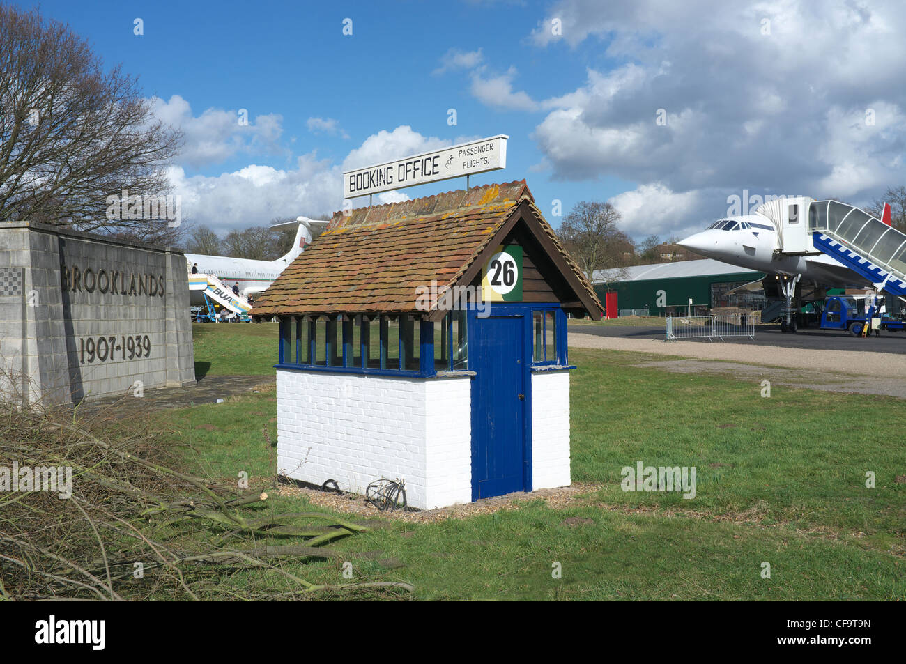 The worlds 1st Booking Office at Brooklands Museum, with Concorde G-BBDG in the background. Also the Brooklands Memorial Stock Photo