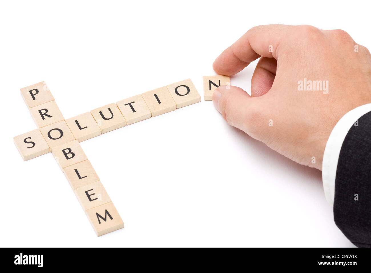 Business man building solution from problem over white background Stock Photo