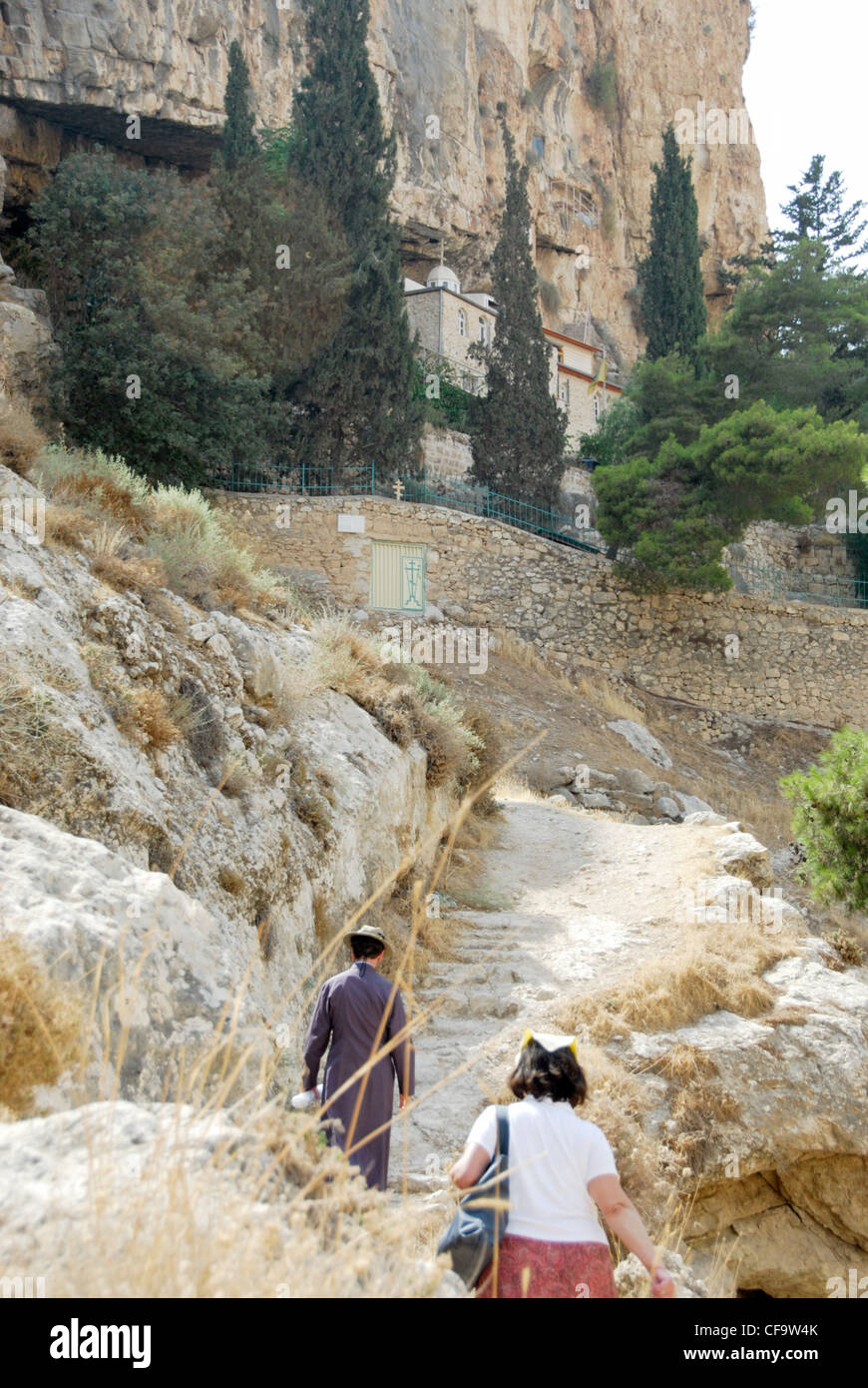 Pilgrims climbing up to the Skete of St. Hariton in the Holy Land Stock Photo