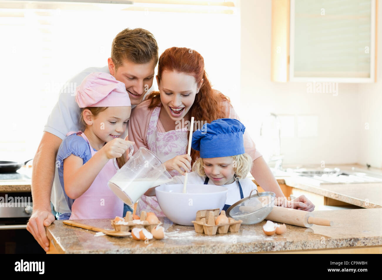 Family having a great time baking together Stock Photo