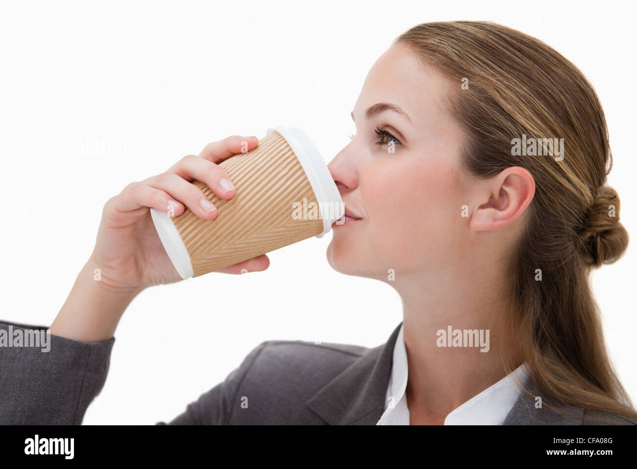 Businesswoman drinking a takeaway coffee Stock Photo