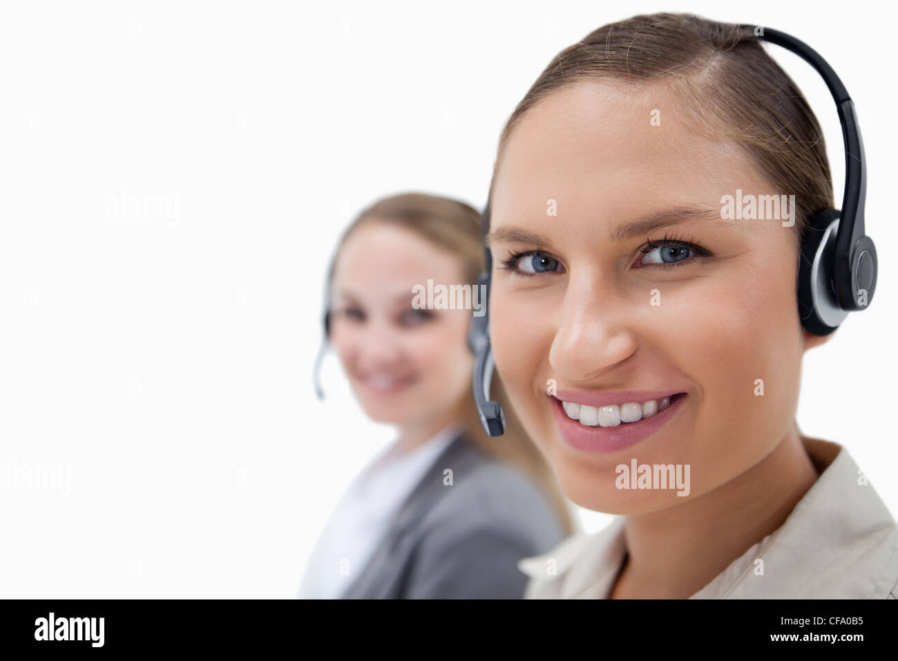 Young female operators using headsets Stock Photo