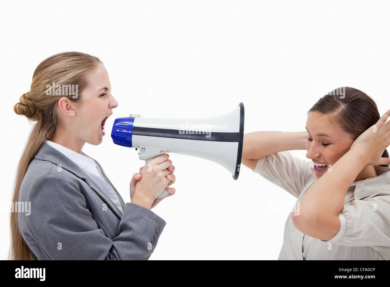 Manager yelling at her coworker through a megaphone Stock Photo