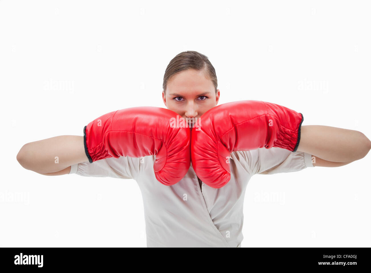 Businesswoman with boxing gloves Stock Photo