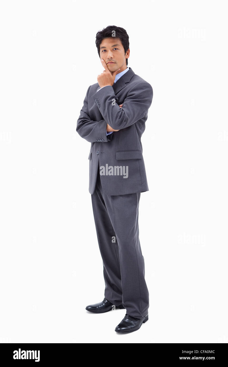 Portrait of a doubtful businessman with the arms crossed Stock Photo