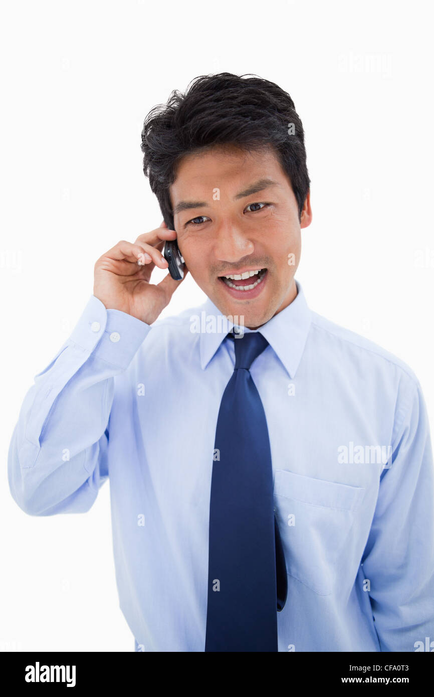 Portrait of a surprised businessman making a phone call Stock Photo