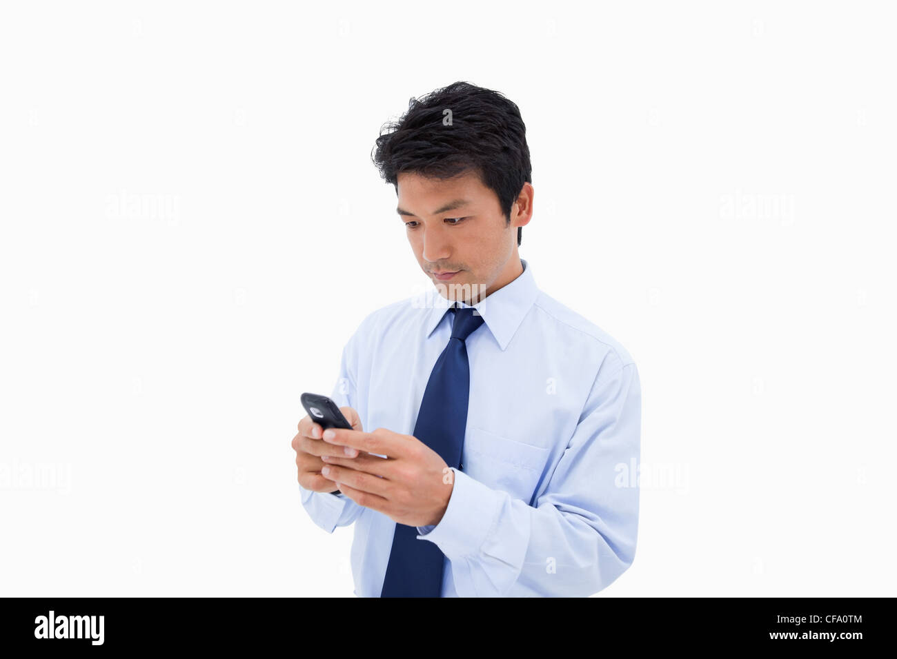 Businessman sending a text message Stock Photo
