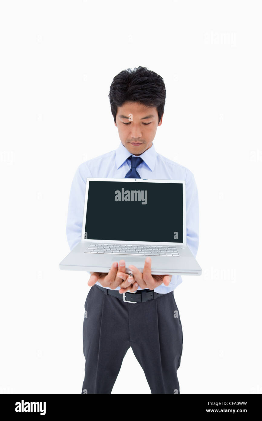 Portrait of a businessman showing a laptop Stock Photo