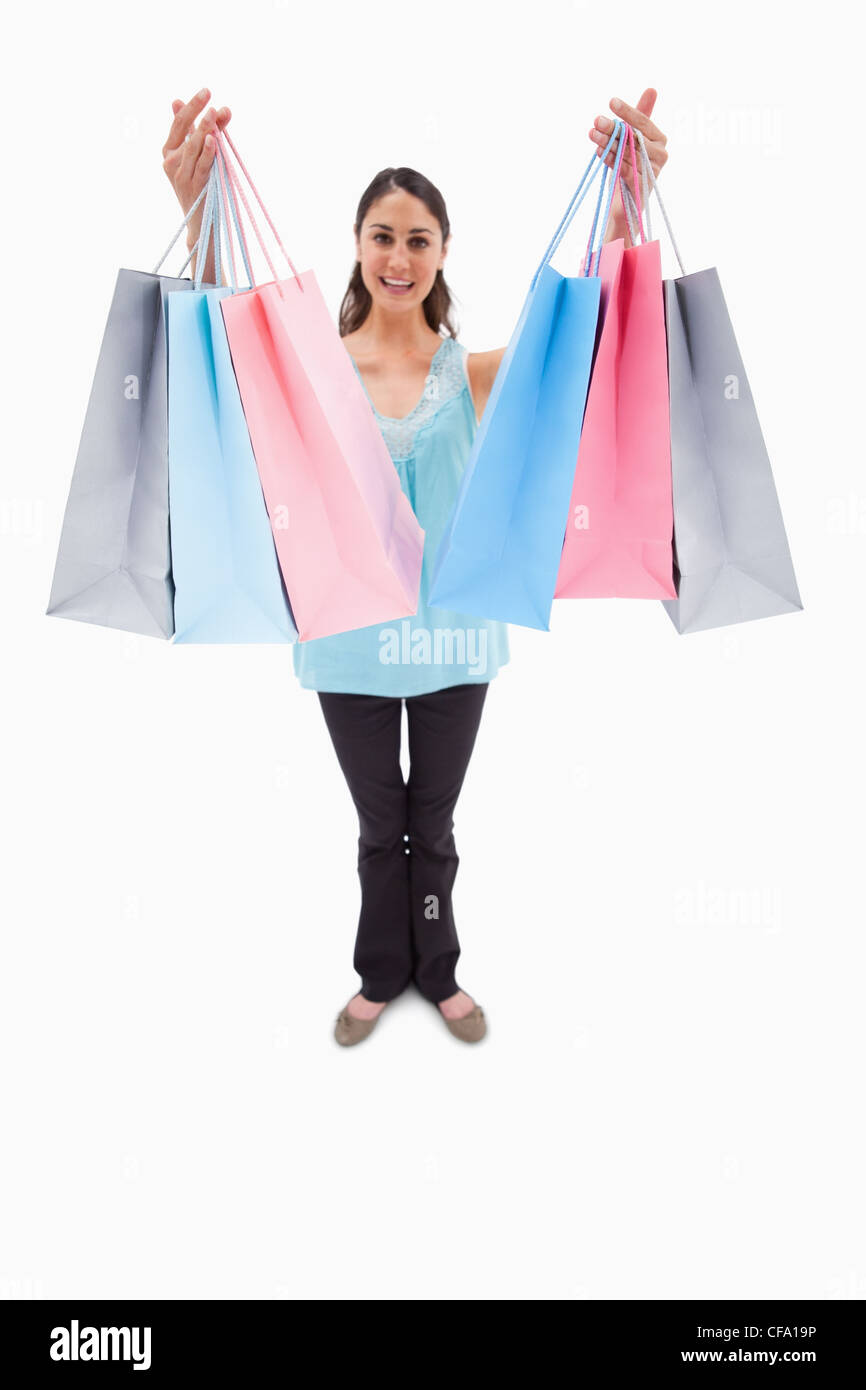Portrait of a woman showing shopping bags Stock Photo