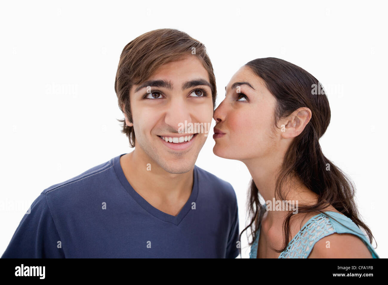 Lovely woman whispering something to her fiance Stock Photo