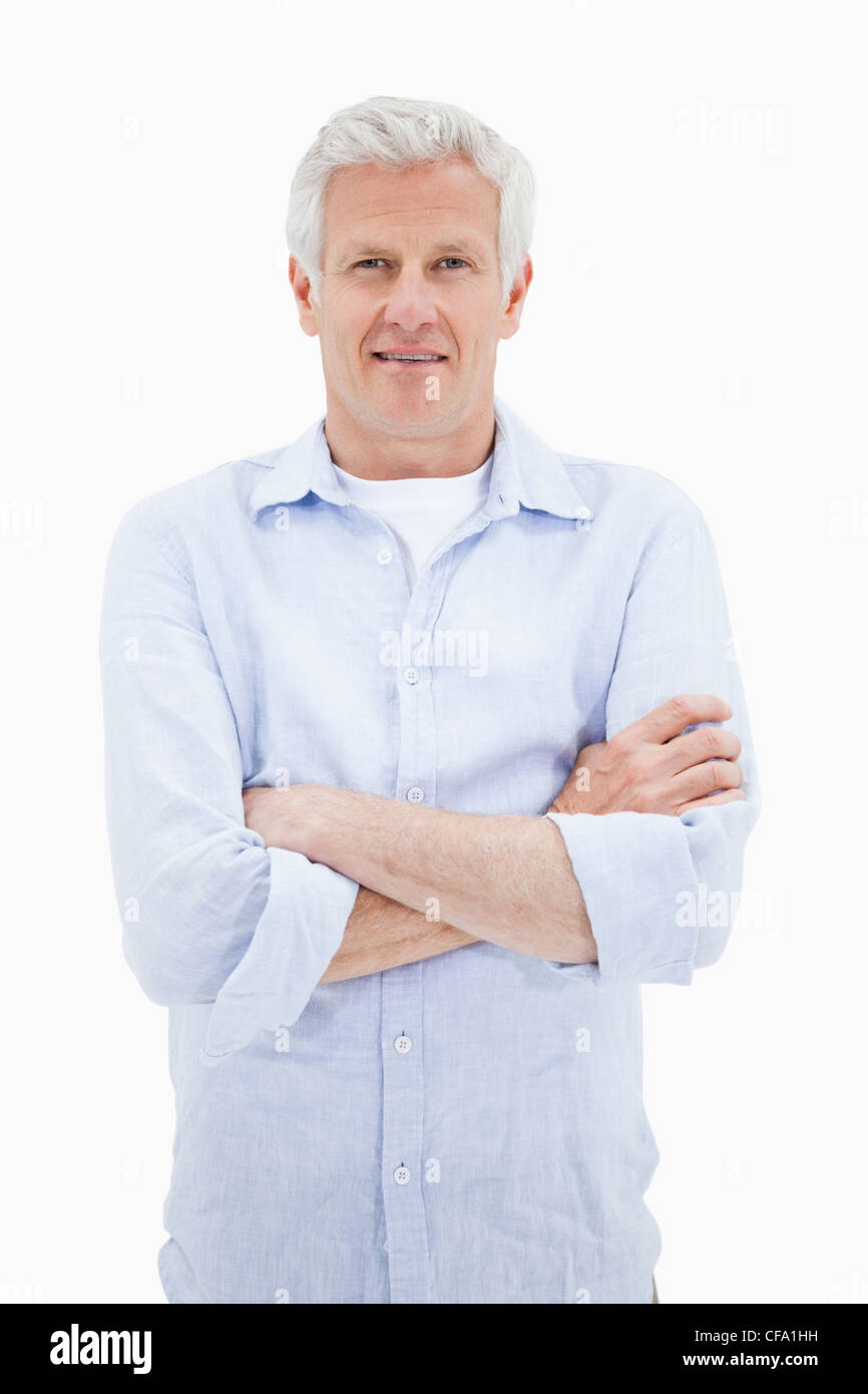 Portrait of a smiling mature man with the arms crossed Stock Photo - Alamy