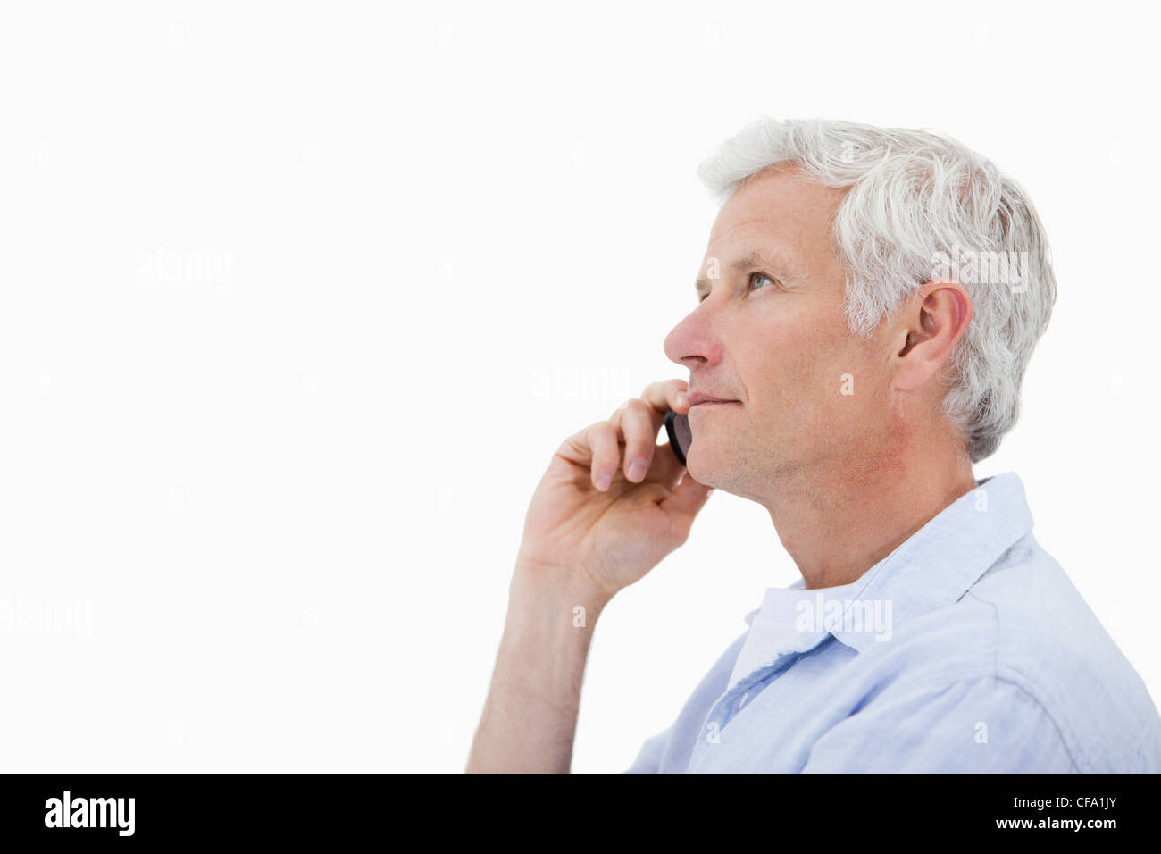 Side view of a man making a phone call Stock Photo