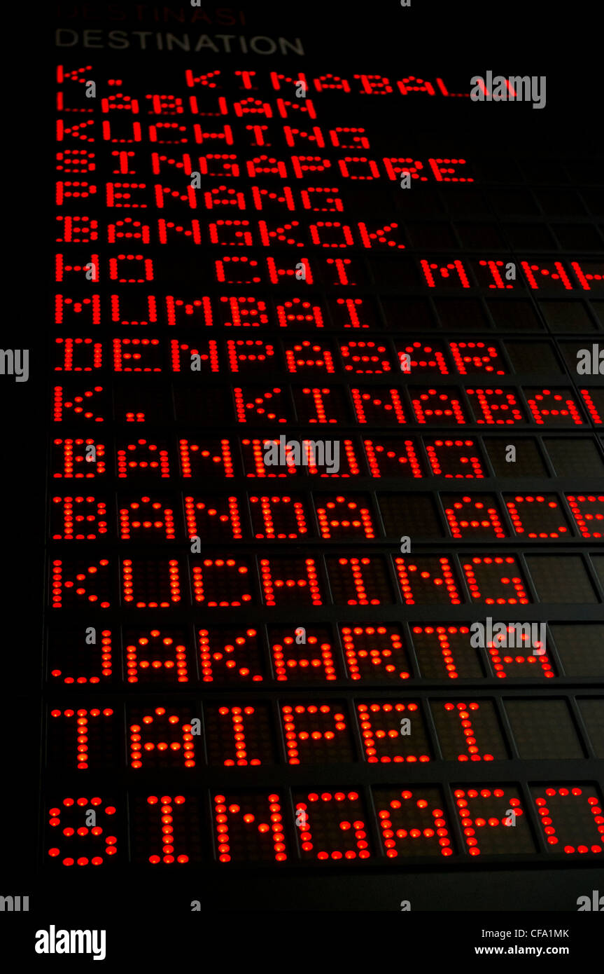 airport departures board that shows asian destinations. Stock Photo