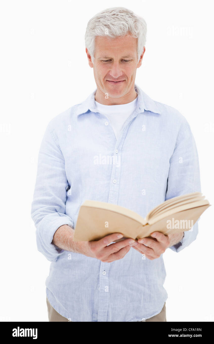 Portrait of a man reading a book Stock Photo