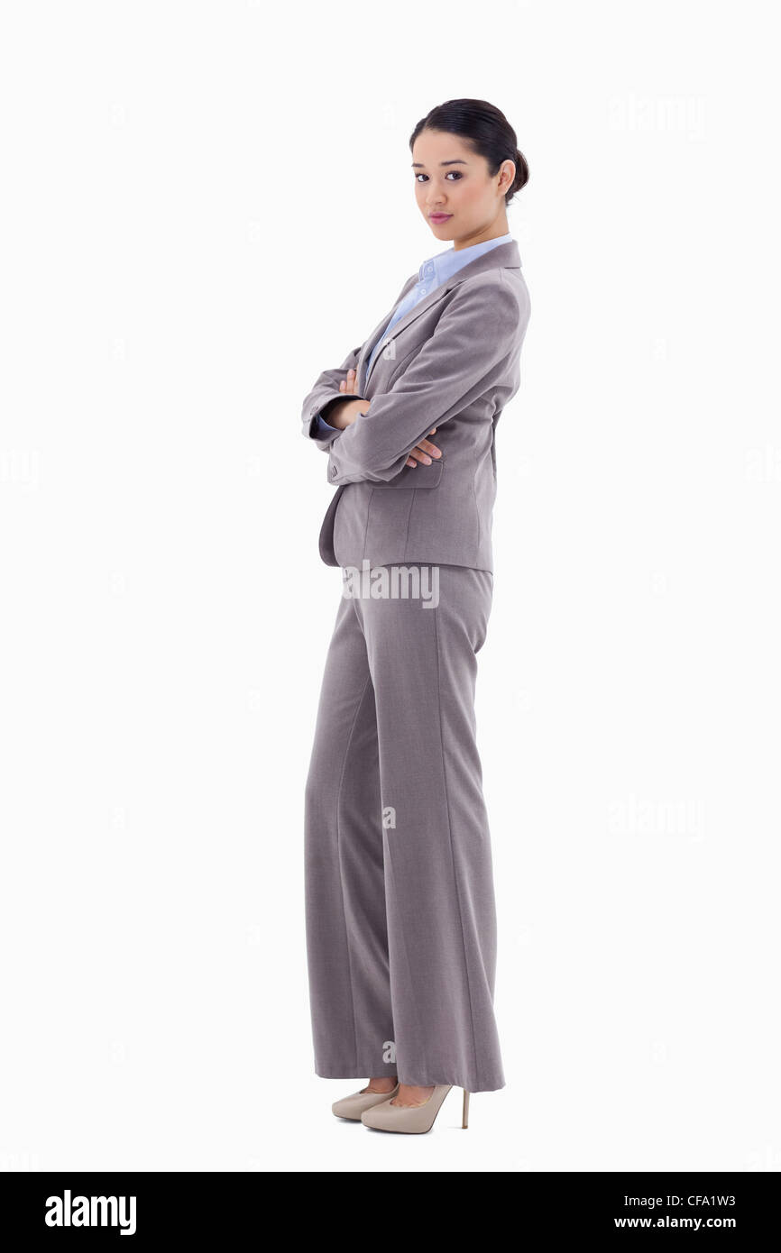 Portrait of a brunette businesswoman posing with the arms crossed Stock Photo
