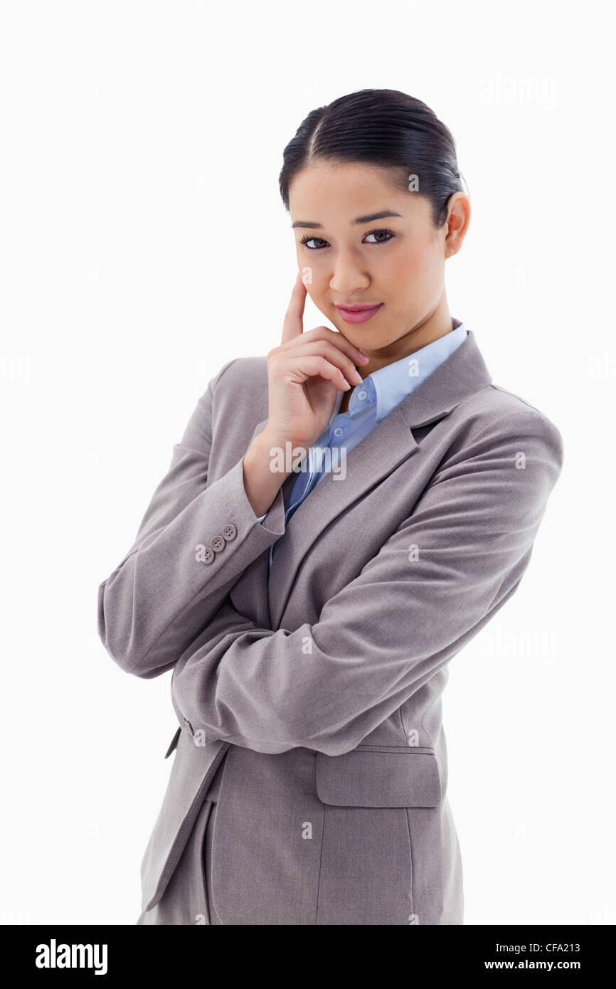 Portrait of a smiling businesswoman thinking Stock Photo